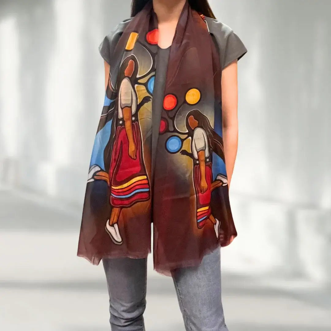 A Skirt with a Story Eco-Scarf displayed by a model, showcasing vibrant cultural designs and sustainable materials.