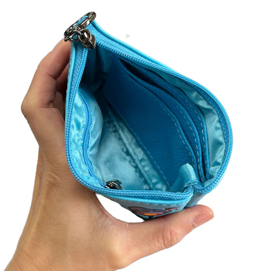 Hand holding a blue wallet with a white background
