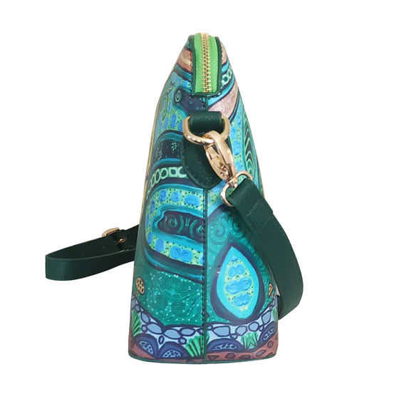 Colorful handbag with a patterned design on a white background
