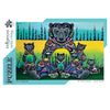 A jigsaw puzzle box from the Indigenous Collection featuring a colorful painted family of bears. The artwork shows a large bear with three cubs in a forest landscape with black trees against yellow, green, and blue gradients.