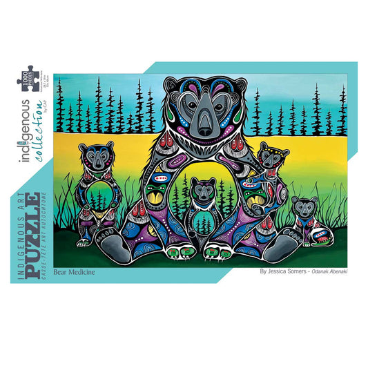 A jigsaw puzzle box from the Indigenous Collection featuring a colorful painted family of bears. The artwork shows a large bear with three cubs in a forest landscape with black trees against yellow, green, and blue gradients.