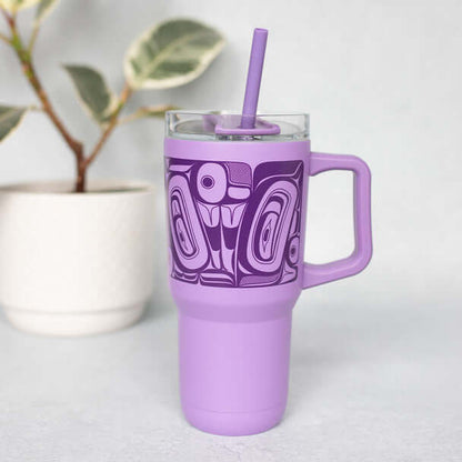 Purple insulated tumbler with butterfly design photographed on a table