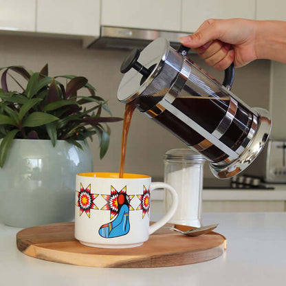 Ceramic mug with Her Ribbon Dress design on table setting