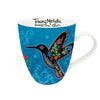 Mug with colorful bird design on a blue background, featuring Tracey Metallics branding.