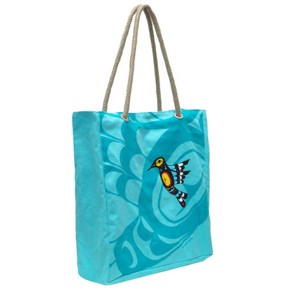Blue tote bag with a bird design on a white background