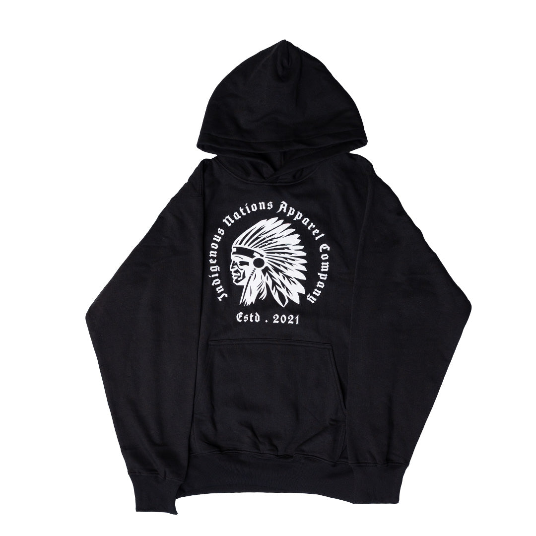 A black pullover hoodie with a white circular graphic on the chest featuring a Native American headdress illustration and the text 'Indigenous Nations Apparel Company' and 'Estd. 2021'.