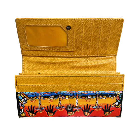 Yellow wallet with a colorful patterned flap on a white background
