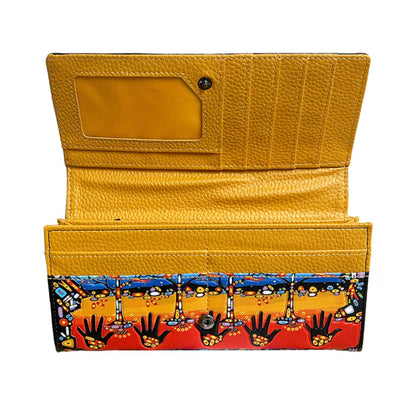 Yellow wallet with a colorful patterned flap on a white background