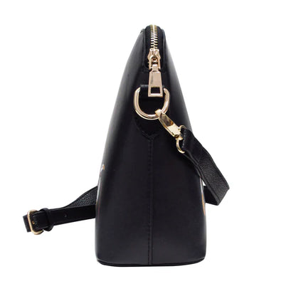 Black handbag with gold zipper and strap on a white background