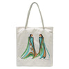 Tote bag with artistic design of two figures in flowing robes on a white background