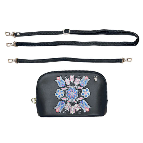 Black handbag with floral embroidery and detachable strap on a white background