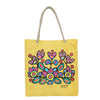 Yellow tote bag with colorful floral design and rope handle on a white background