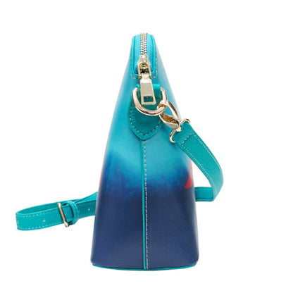 Blue gradient handbag with a gold zipper on a white background