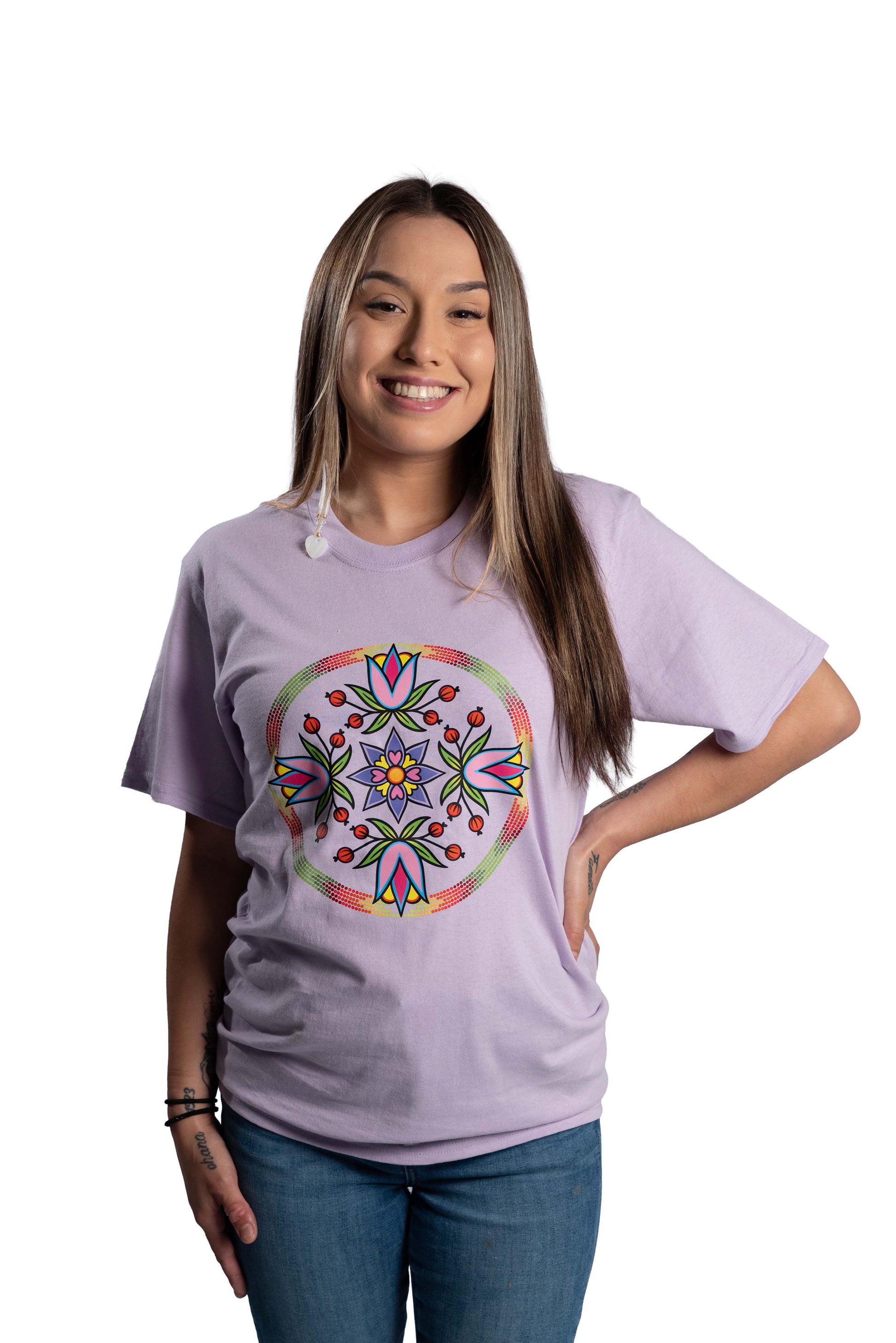 Woman wearing a purple t-shirt with a colorful mandala design on a white background