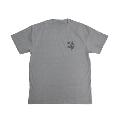 Flat lay front view of Cedar Medicine Tee in grey with Indigenous cultural print