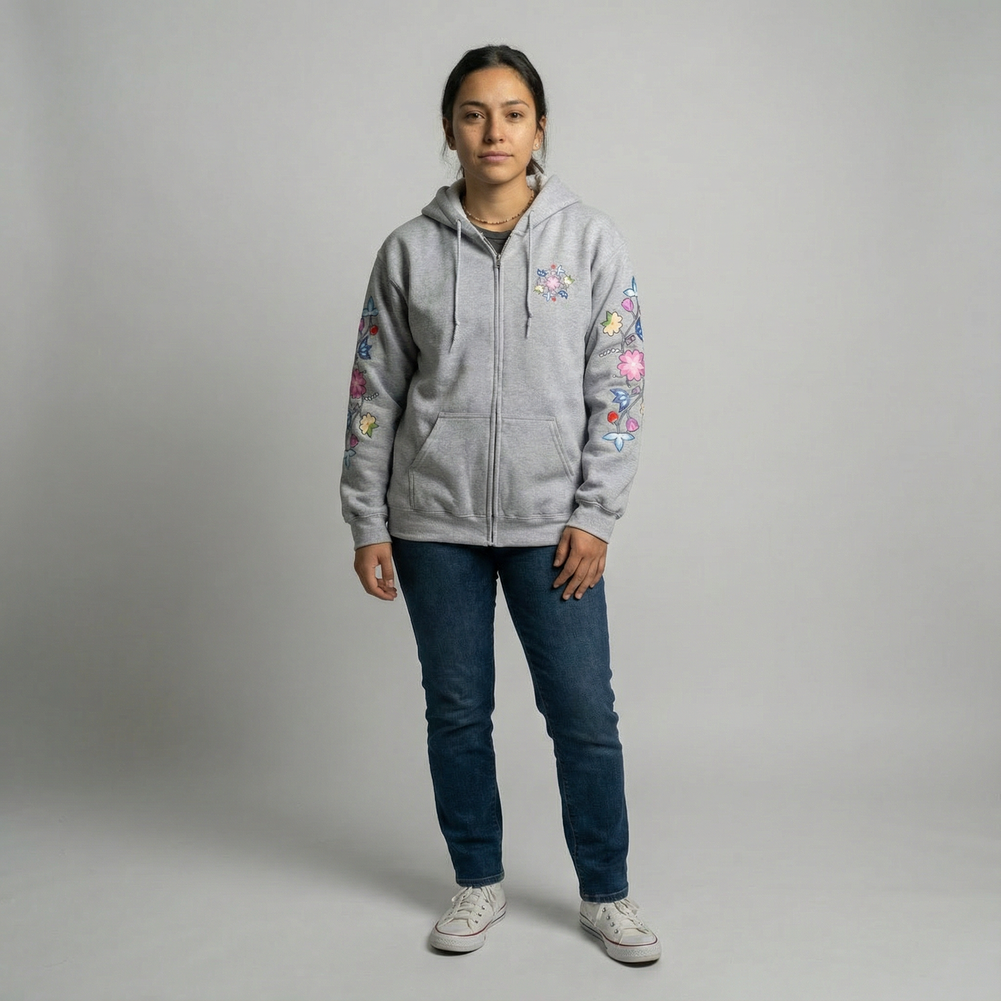 Model wearing McPhee Floral Zip-Up Hoodie with colorful floral designs, showcasing a cozy and stylish look.