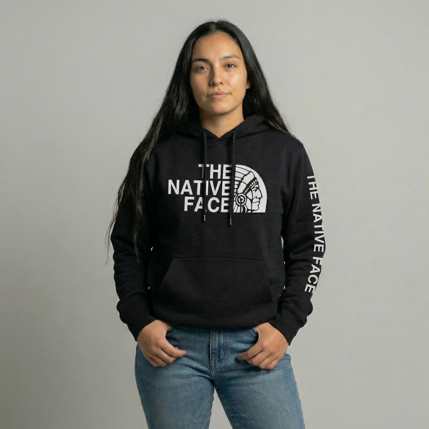 Woman wearing the Native Face Hoodie, featuring the iconic graphic and relaxed fit.