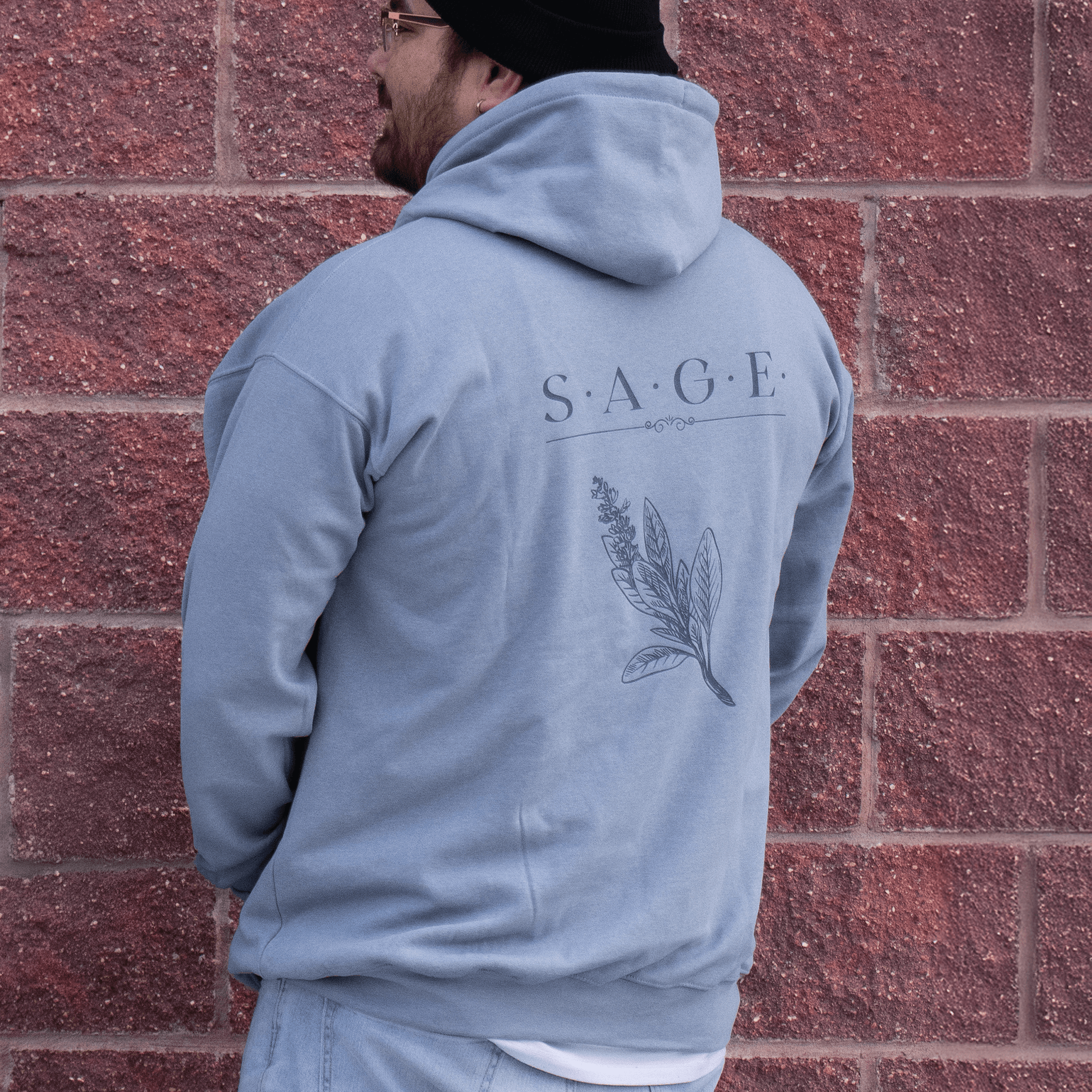 Back view of Sage Medicine Hoodie showing hood and print and relaxed fit