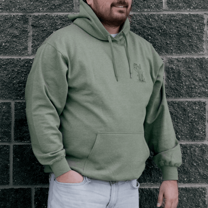 Front view of Sweetgrass Medicine Hoodie in green Indigenous streetwear inspired by tradition