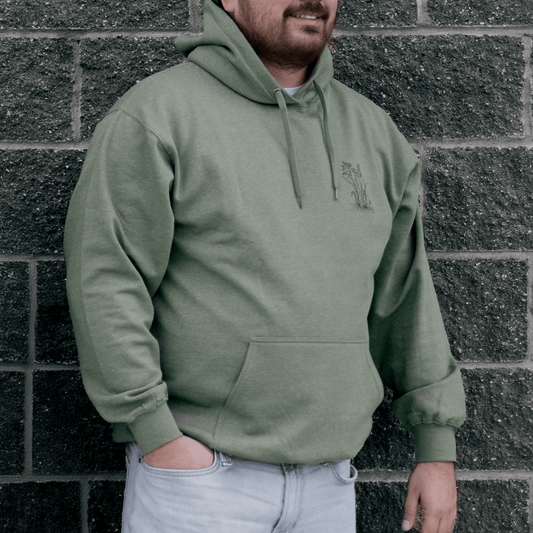 Front view of Sweetgrass Medicine Hoodie in green Indigenous streetwear inspired by tradition