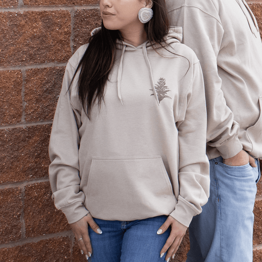 Front view of Tobacco Medicine Hoodie in beige Indigenous streetwear with cultural design
