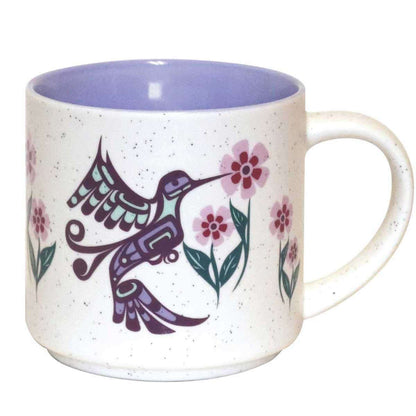 Mug with a hummingbird and floral design on a white background