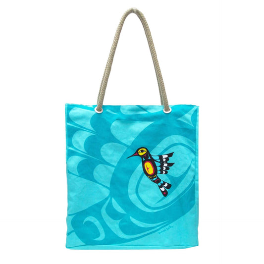 Blue tote bag with a colorful bird design on a white background
