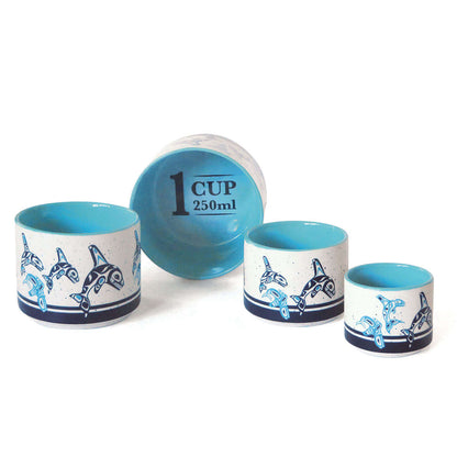 Orca Family - Ceramic Measuring Cup Set featuring ocean-themed designs in various sizes.