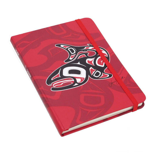 Red notebook with a black and white design on a white background